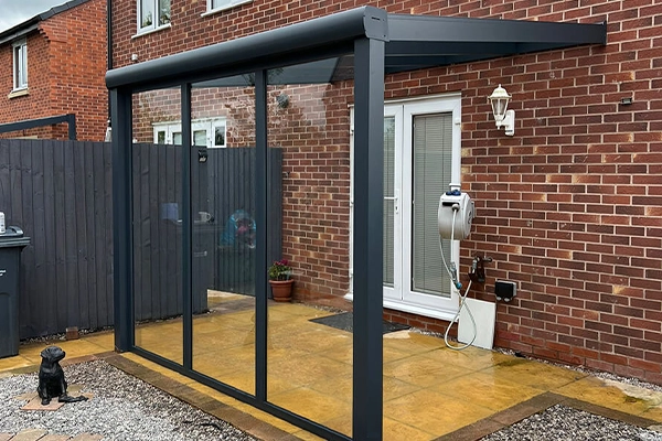 black aluminium veranda with glass panels