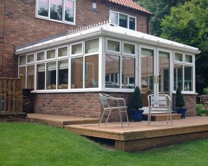 new conservatory with a wooden deck