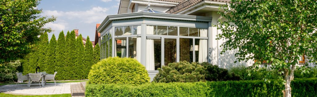 Luxurious mansion with orangery surrounded by garden