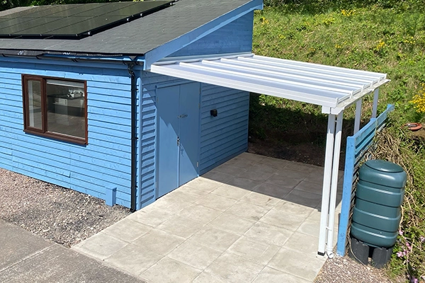 white aluminium veranda installation on the side of the house