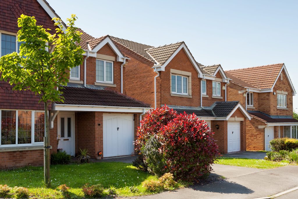 Red brick house with white Fascia and Soffit